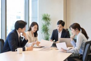 한국인 실무자들이 회의실에서 사단법인 정관과 목적사업을 검토하는 모습